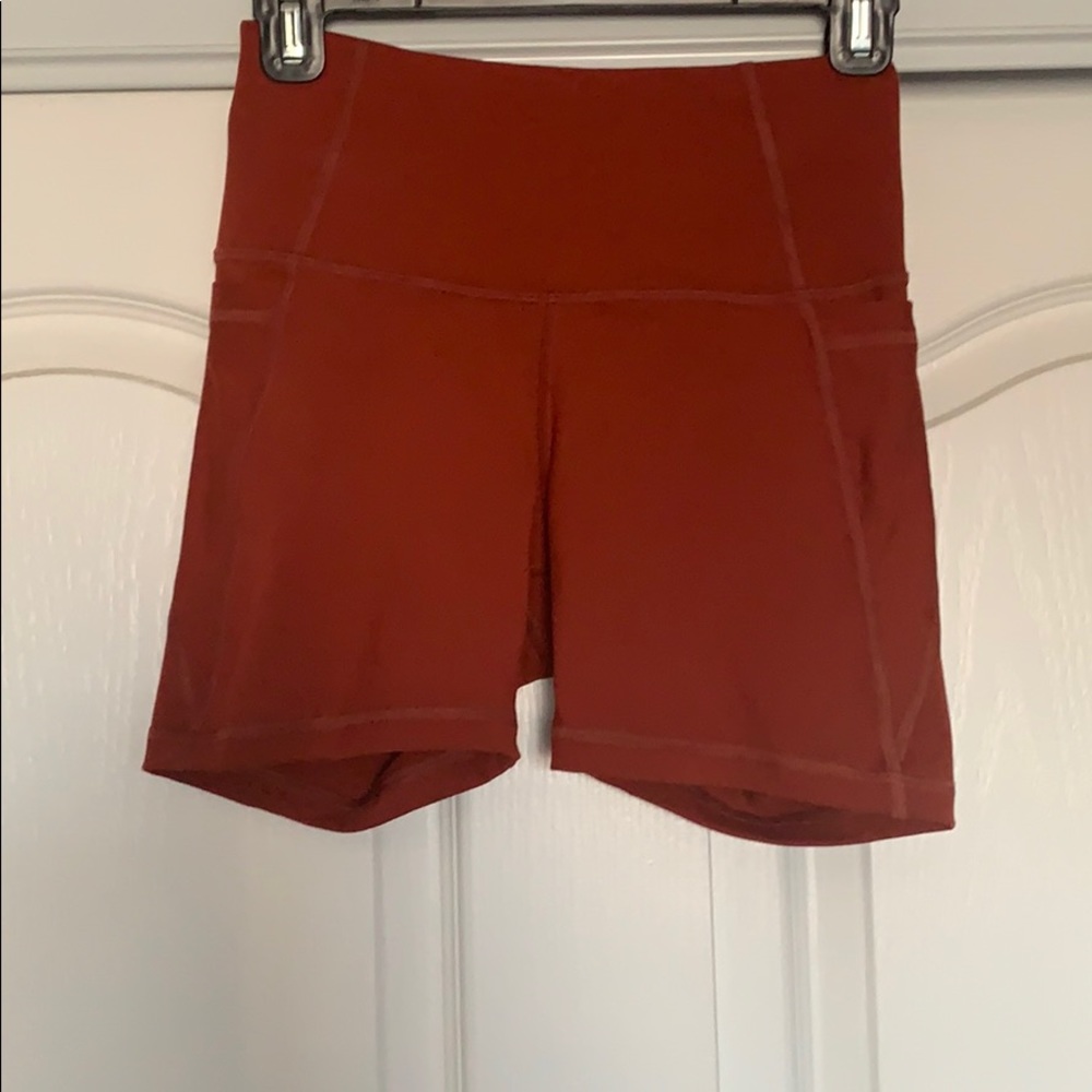 Copper colored biker short. Just under 6”